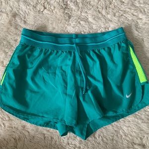Green Nike running shorts